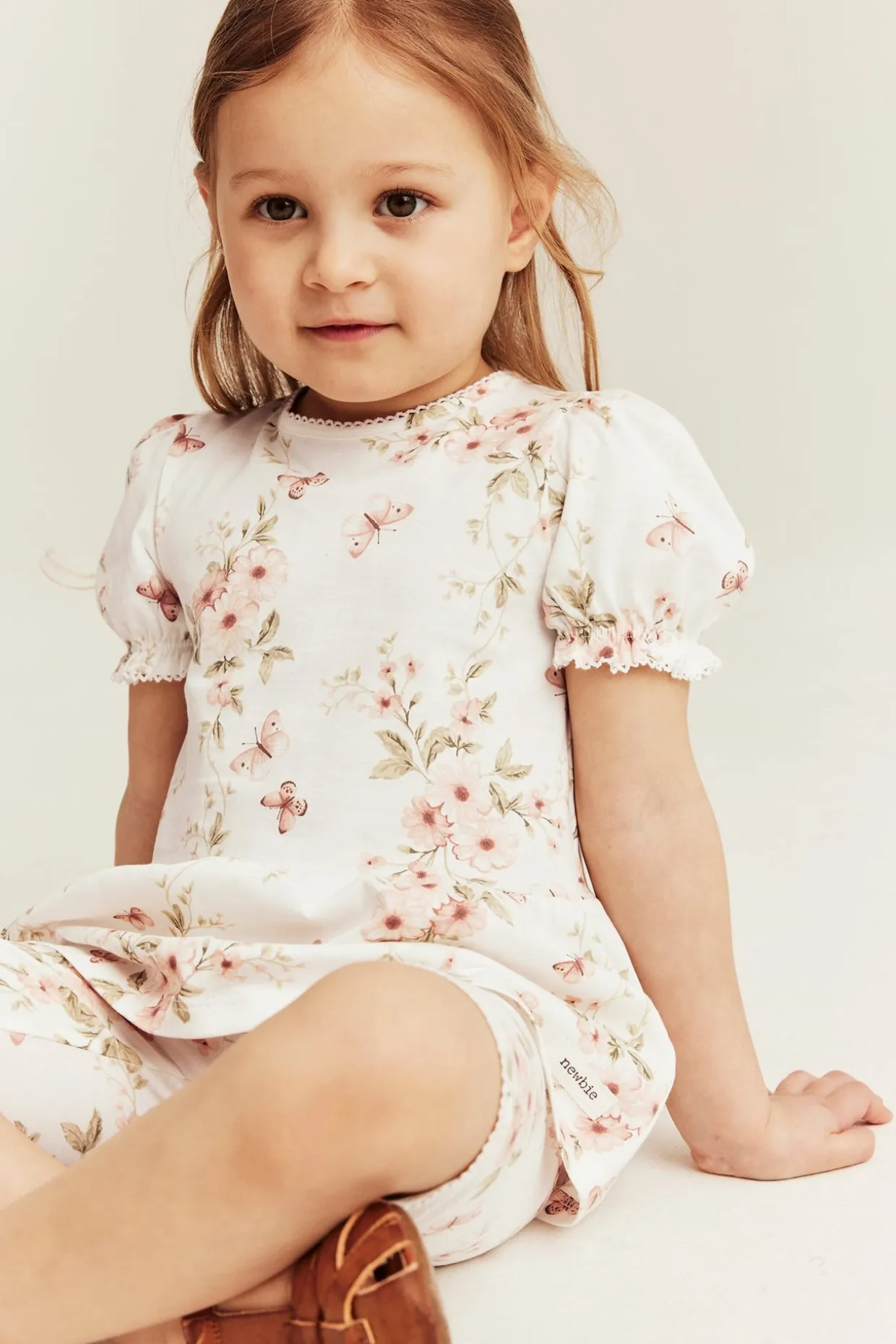 Top peplum w kwiaty i motyle